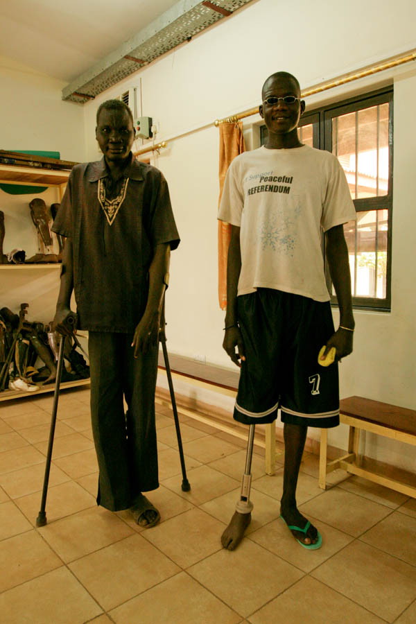 Two South Sudanese men, proud of their increasing mobility at the Physical Rehabilitation Reference Centre in Juba, South Sudan